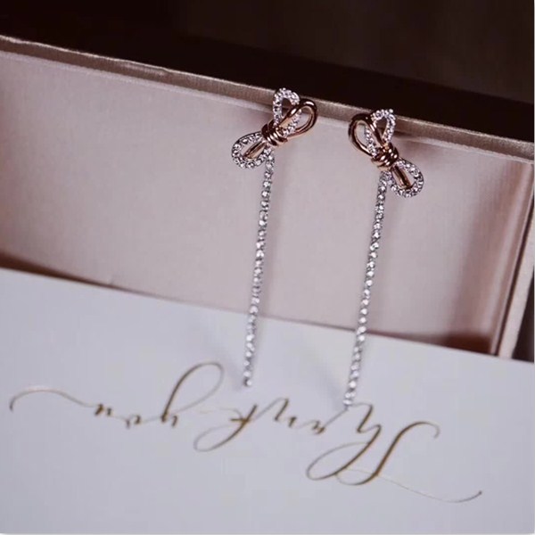 replica,repliche,fake,1:1,earrings,bracelet,ring,jewelry Orecchini fiocco Swarovski