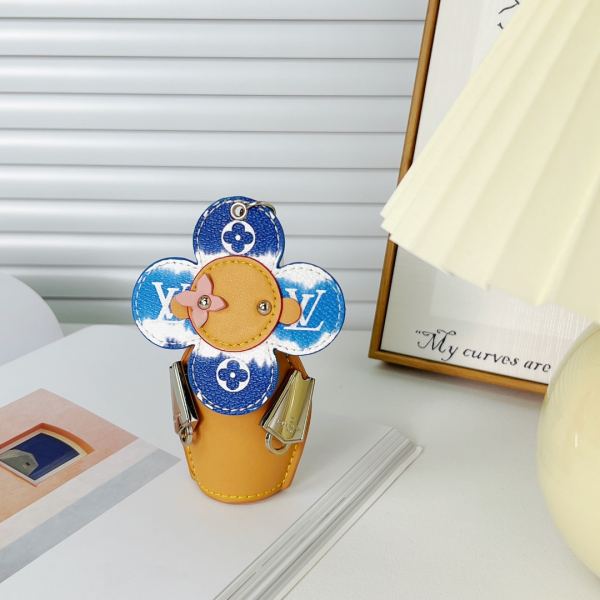 replica,repliche,fake,1:1,earrings,bracelet,ring,jewelry Portachiavi bambola Louis Vuitton Girasole/MP3069