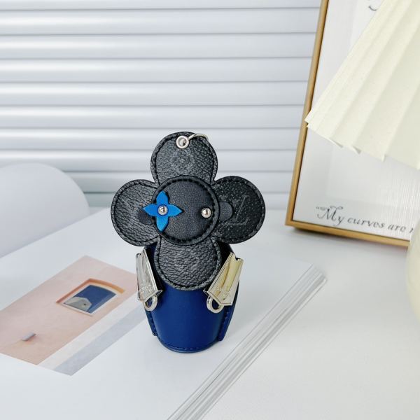 replica,repliche,fake,1:1,earrings,bracelet,ring,jewelry Portachiavi bambola Louis Vuitton Girasole/MP3069