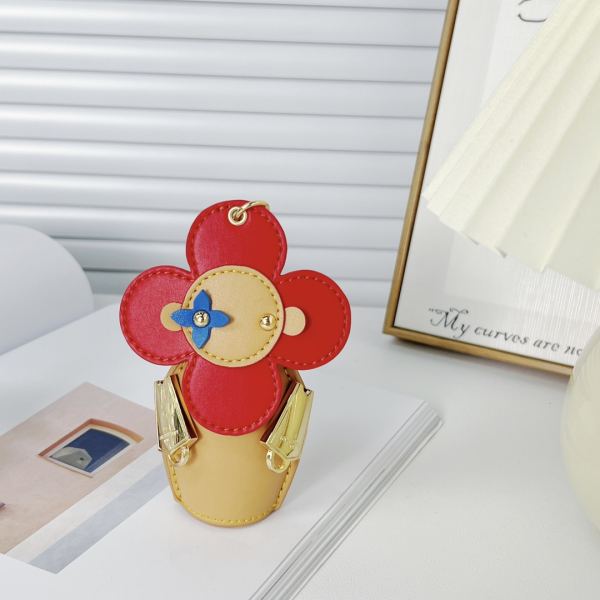 replica,repliche,fake,1:1,earrings,bracelet,ring,jewelry Portachiavi bambola Louis Vuitton Girasole/MP3069