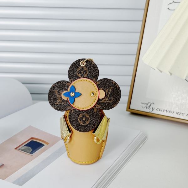 replica,repliche,fake,1:1,earrings,bracelet,ring,jewelry Portachiavi bambola Louis Vuitton Girasole/MP3069