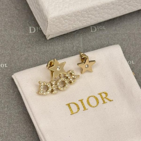 Orecchini asimmetrici con stella Dor letter