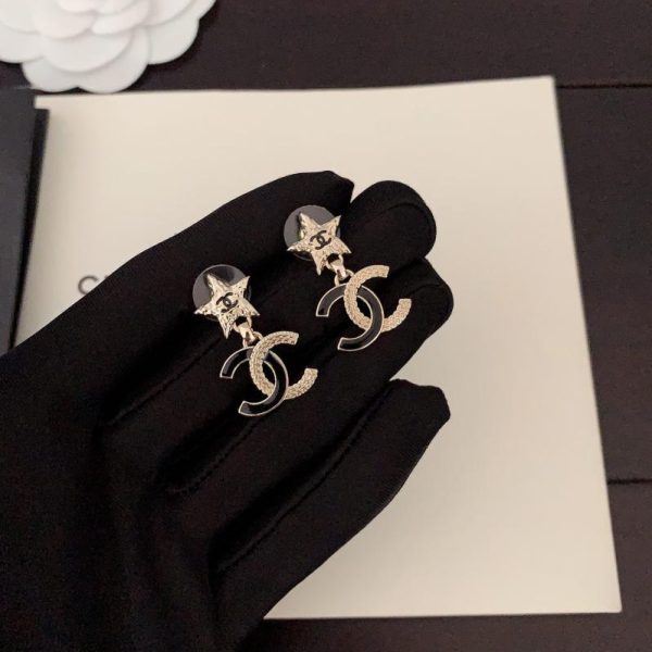 Orecchini Chanel neri bicolore stella a cinque punte