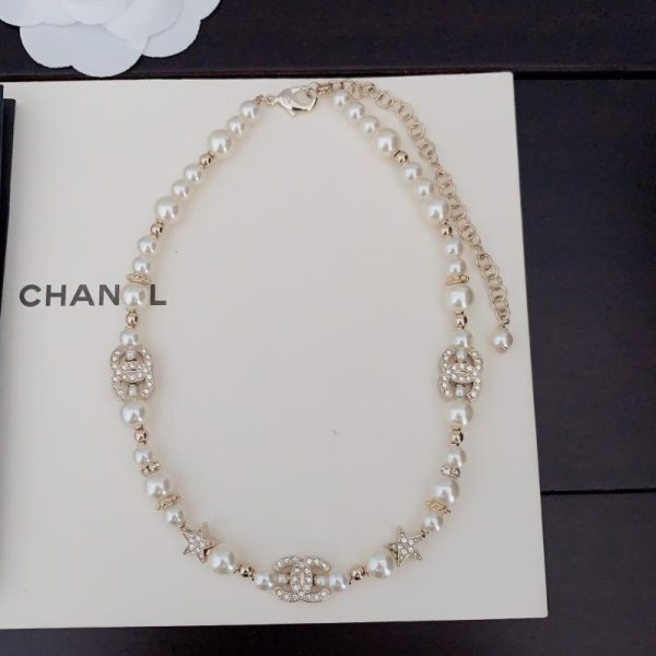 replica,repliche,fake,1:1,earrings,bracelet,ring,jewelry Collana Chanel con perle bianche