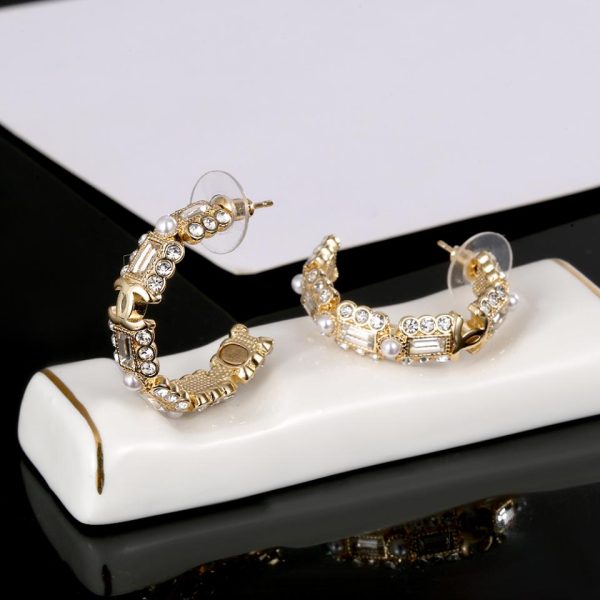 replica,repliche,fake,1:1,earrings,bracelet,ring,jewelry Orecchini Chanel in oro chiaro con diamanti