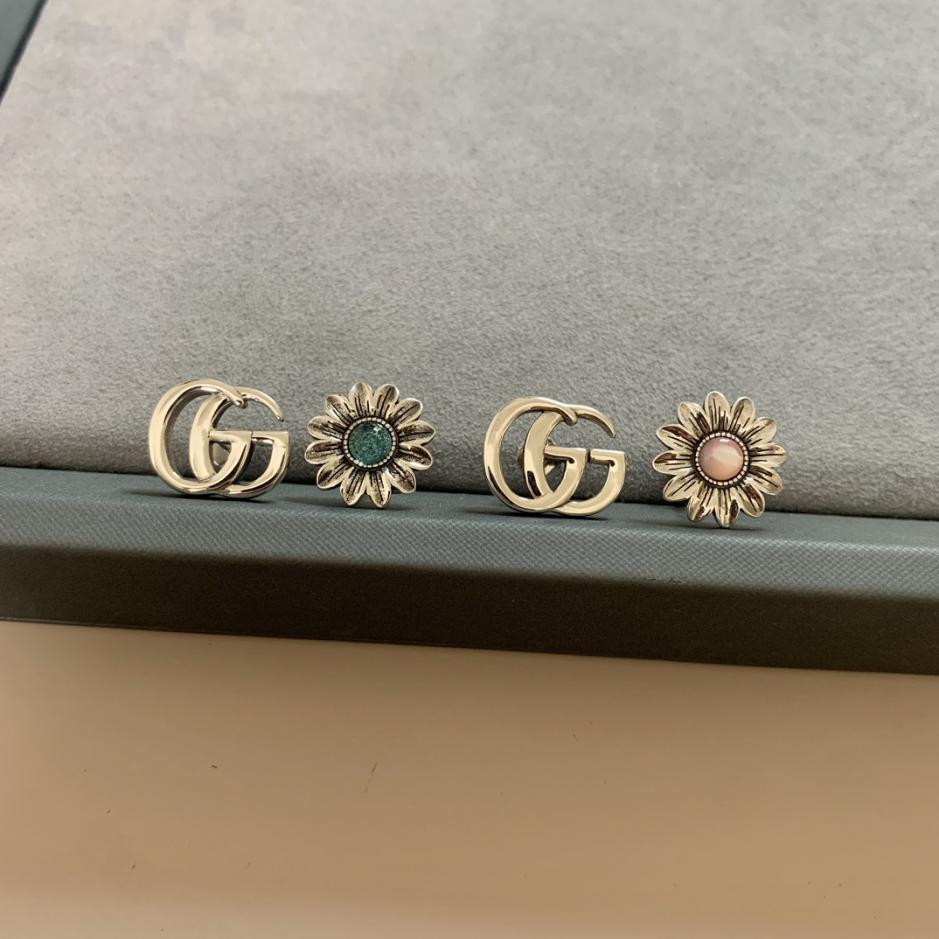 replica,repliche,fake,1:1,earrings,bracelet,ring,jewelry Orecchini a bottone con margherita doppia G intrecciata di Gucci replica,repliche,fake,1:1,earrings,bracelet,ring,jewelry Orecchini a bottone con margherita doppia G intrecciata di Gucci