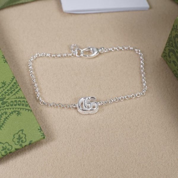Bracciale Gucci doppia g in argento e bianco