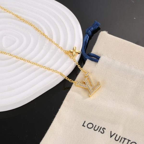 Lettere dorate LOUIS VUITTON