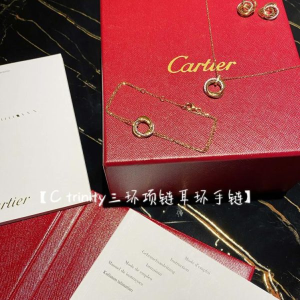 replica,repliche,fake,1:1,earrings,bracelet,ring,jewelry Orecchini con bracciale e collana a tre anelli di Cartier