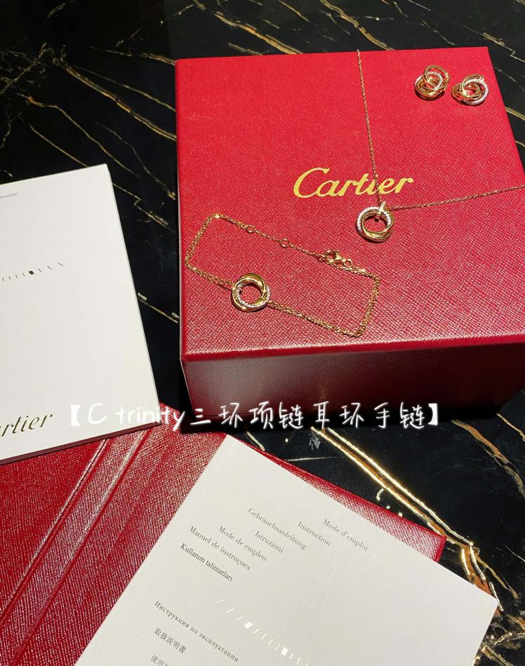 replica,repliche,fake,1:1,earrings,bracelet,ring,jewelry Orecchini con bracciale e collana a tre anelli di Cartier