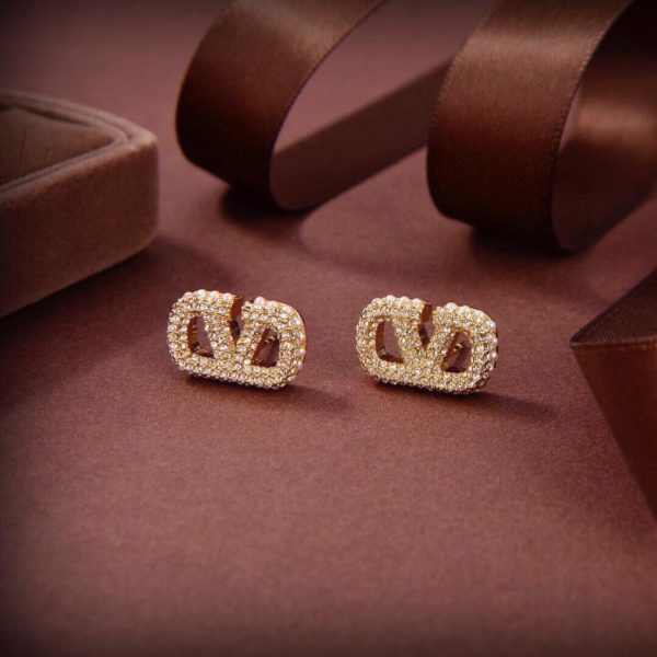 replica,repliche,fake,1:1,earrings,bracelet,ring,jewelry Orecchini Valentino metà perla metà diamante
