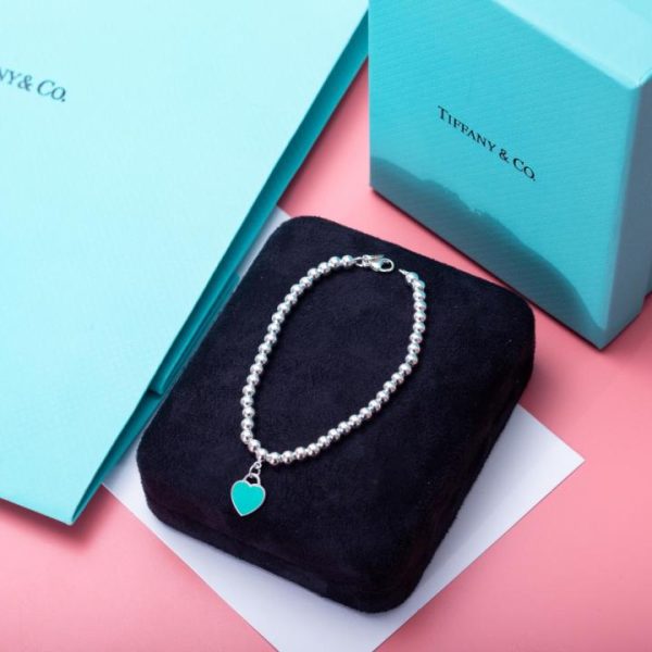 replica,repliche,fake,1:1,earrings,bracelet,ring,jewelry Bracciale Tiffany T con cuore blu e perline