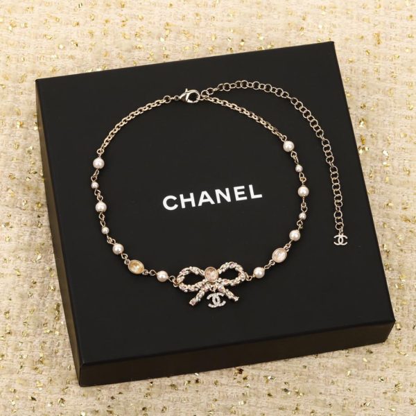replica,repliche,fake,1:1,earrings,bracelet,ring,jewelry Collana Chanel con perle twist e fiocco di diamanti rosa