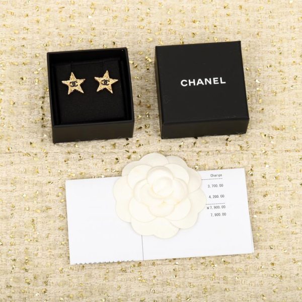 replica,repliche,fake,1:1,earrings,bracelet,ring,jewelry Orecchini Chanel doppia c con stella con texture lava