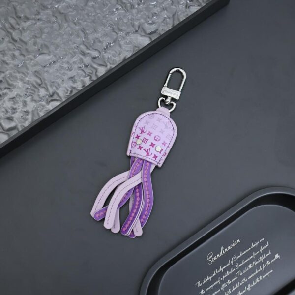 replica,repliche,fake,1:1,earrings,bracelet,ring,jewelry Ciondolo per borsa portachiavi con logo mini calamaro di Louis Vuitton