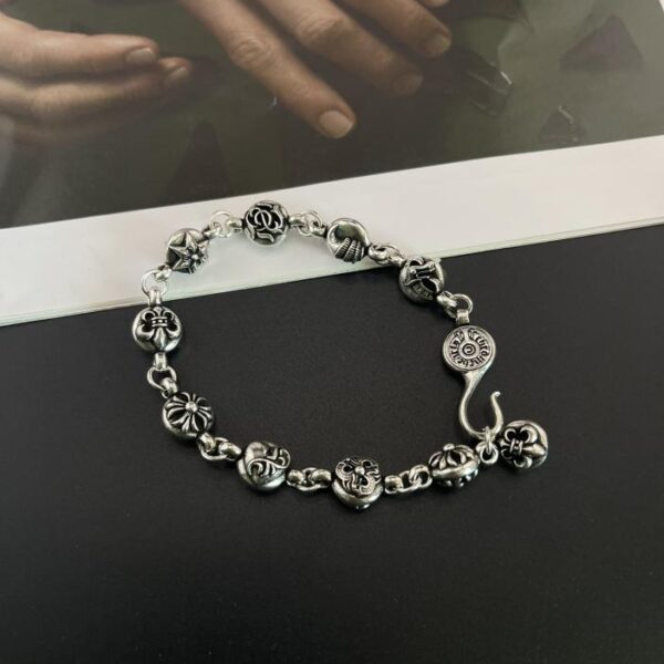replica,repliche,fake,1:1,earrings,bracelet,ring,jewelry Bracciale multielemento cuore di corvo (75FF)