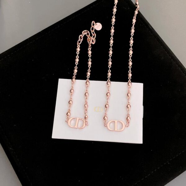 65 Collana con braccialetto di perline di metallo cd Dior (A2C2)