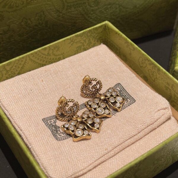 replica,repliche,fake,1:1,earrings,bracelet,ring,jewelry Gucci Orecchini a fiocco Doppia G ad incastro stile classico (42F8)