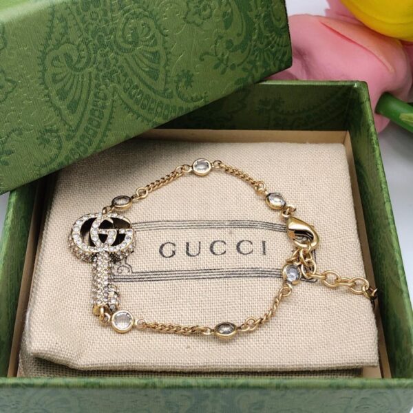 Bracciale Gucci con chiave doppia G in cristallo (219B)