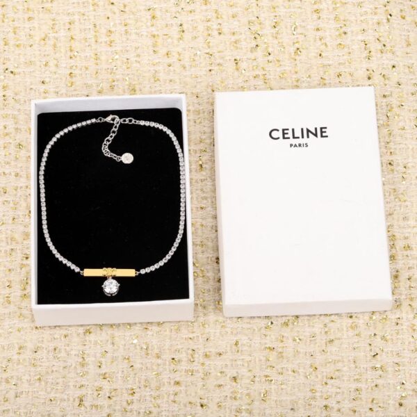 Collana Celine con lingotto d'oro e diamanti