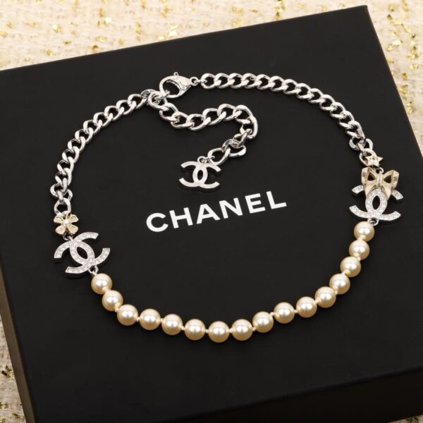replica,repliche,fake,1:1,earrings,bracelet,ring,jewelry Collana doppia C con fiocco a catena di perle Chanel