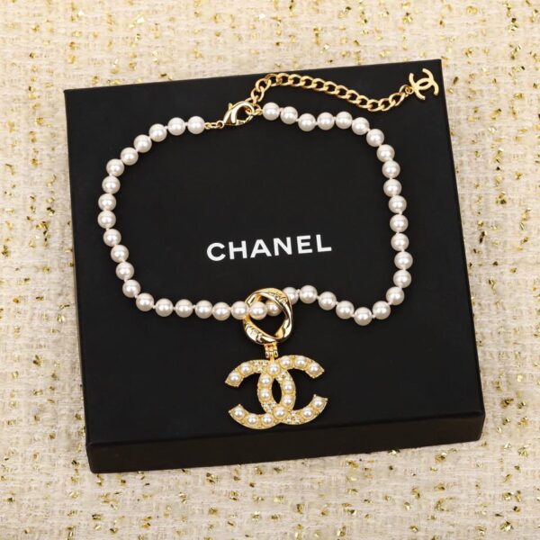 replica,repliche,fake,1:1,earrings,bracelet,ring,jewelry Collana Chanel con perle doppie pendenti con gancio