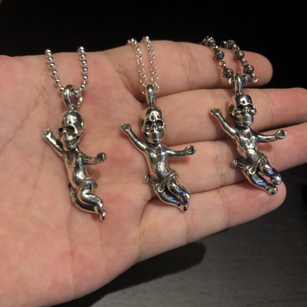 replica,repliche,fake,1:1,earrings,bracelet,ring,jewelry Collana con teschio Foti con cuori cromati