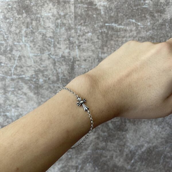replica,repliche,fake,1:1,earrings,bracelet,ring,jewelry Bracciale con perle incrociate con cuori cromati