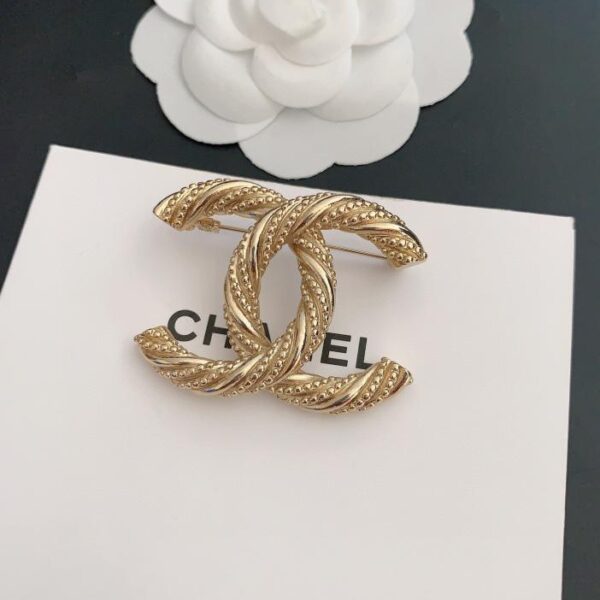 replica,repliche,fake,1:1,earrings,bracelet,ring,jewelry Spilla in oro Chanel ultima torsione (DB22)