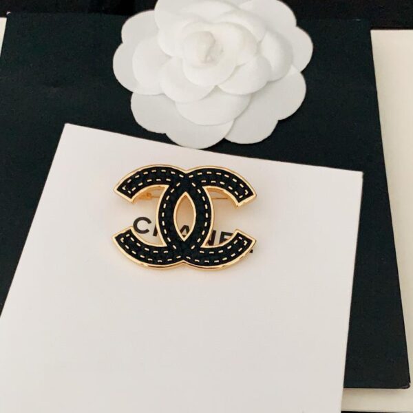 replica,repliche,fake,1:1,earrings,bracelet,ring,jewelry Chanel ultima spilla nera (4035)