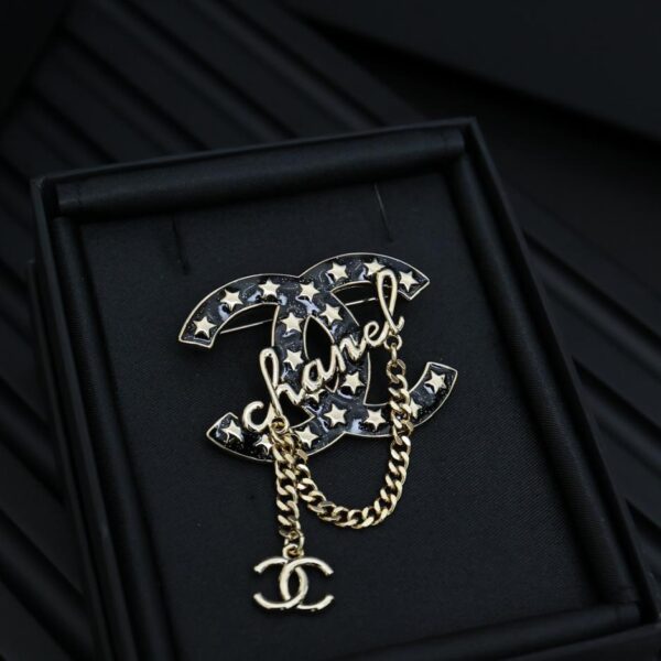 replica,repliche,fake,1:1,earrings,bracelet,ring,jewelry Spilla Chanel con stella e catena di nappe (9AFC)