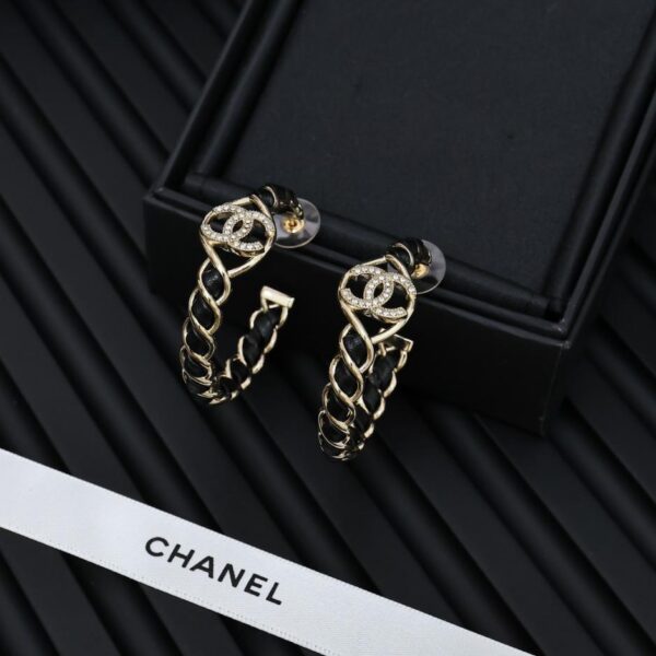 Orecchini grandi Chanel in pelle oro nero 24K (61B2)