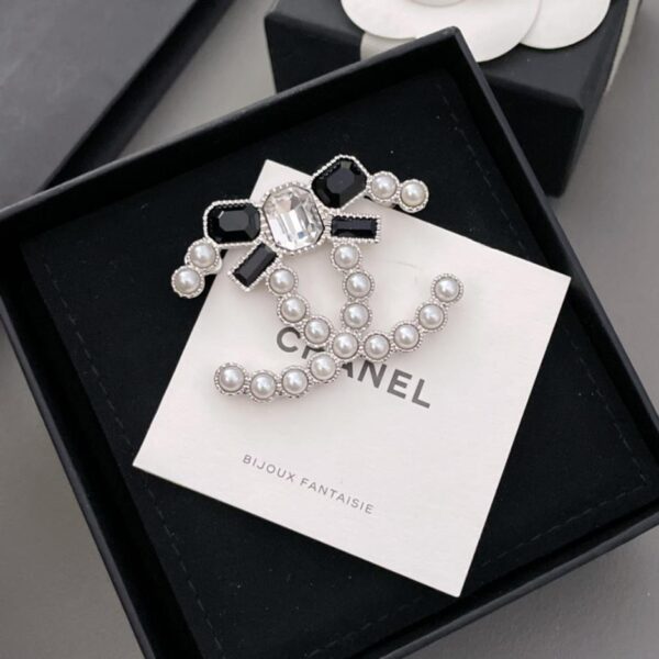 replica,repliche,fake,1:1,earrings,bracelet,ring,jewelry Spilla Chanel con fiocco doppia c (9E66)