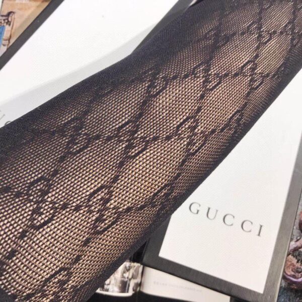 Tuta GUCCI in rete con logo in vita,