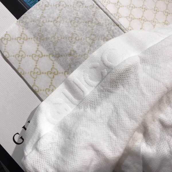 Tuta GUCCI in rete con logo in vita,