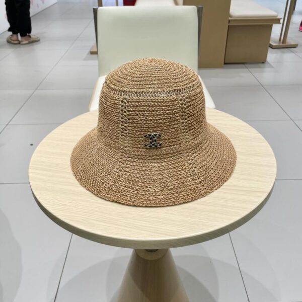 replica,repliche,fake,1:1,earrings,bracelet,ring,jewelry Cappello da sole di alta qualità di alta qualità di vendita calda di Chanel cappello da pescatore vuoto cappello di paglia da viaggio estivo a cupola