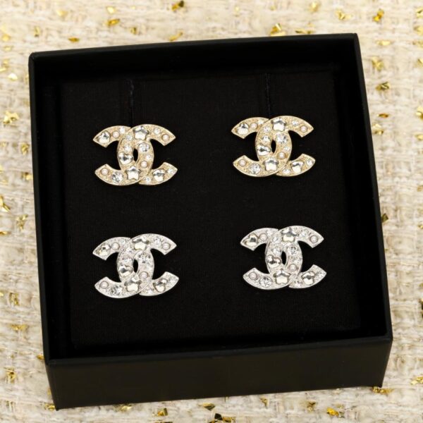 Orecchini Chanel Love a forma di stella a cinque punte con doppia C in oro e argento (CT549)
