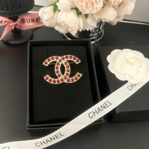 replica,repliche,fake,1:1,earrings,bracelet,ring,jewelry Spilla Chanel con doppia C in ambra e strass (VNG5E)