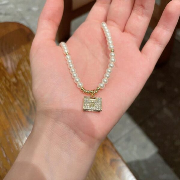 replica,repliche,fake,1:1,earrings,bracelet,ring,jewelry Collana vintage con lettera Chanel (WUT8C)
