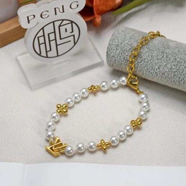 replica,repliche,fake,1:1,earrings,bracelet,ring,jewelry Bracciale LV Gold Flower Pearl Nuovo di alta qualità in ottone e resina di perle (BHFUP)