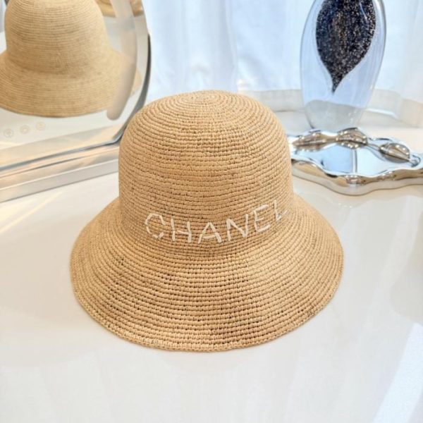 replica,repliche,fake,1:1,earrings,bracelet,ring,jewelry Cappello da pescatore Chanel in paglia intrecciata a mano, rafia naturale lavorata all’uncinetto a mano (L228A0)